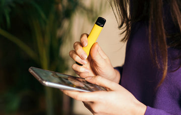 A person holding a vape
