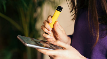 A person holding a vape
